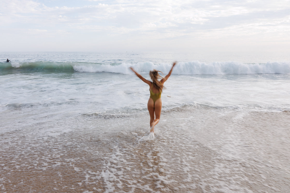 Woman running in the ocean