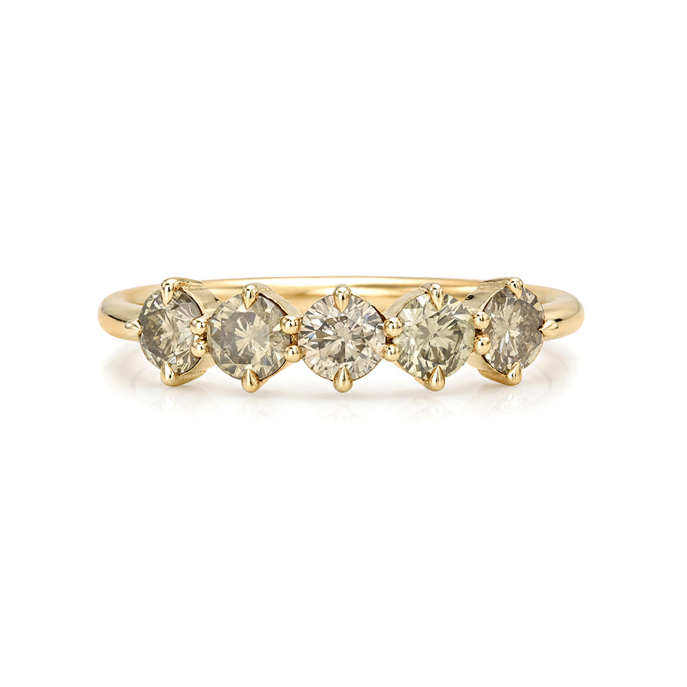 A yellow gold diamond band ring featuring five round-cut diamonds set in a row, shown against a plain white background.