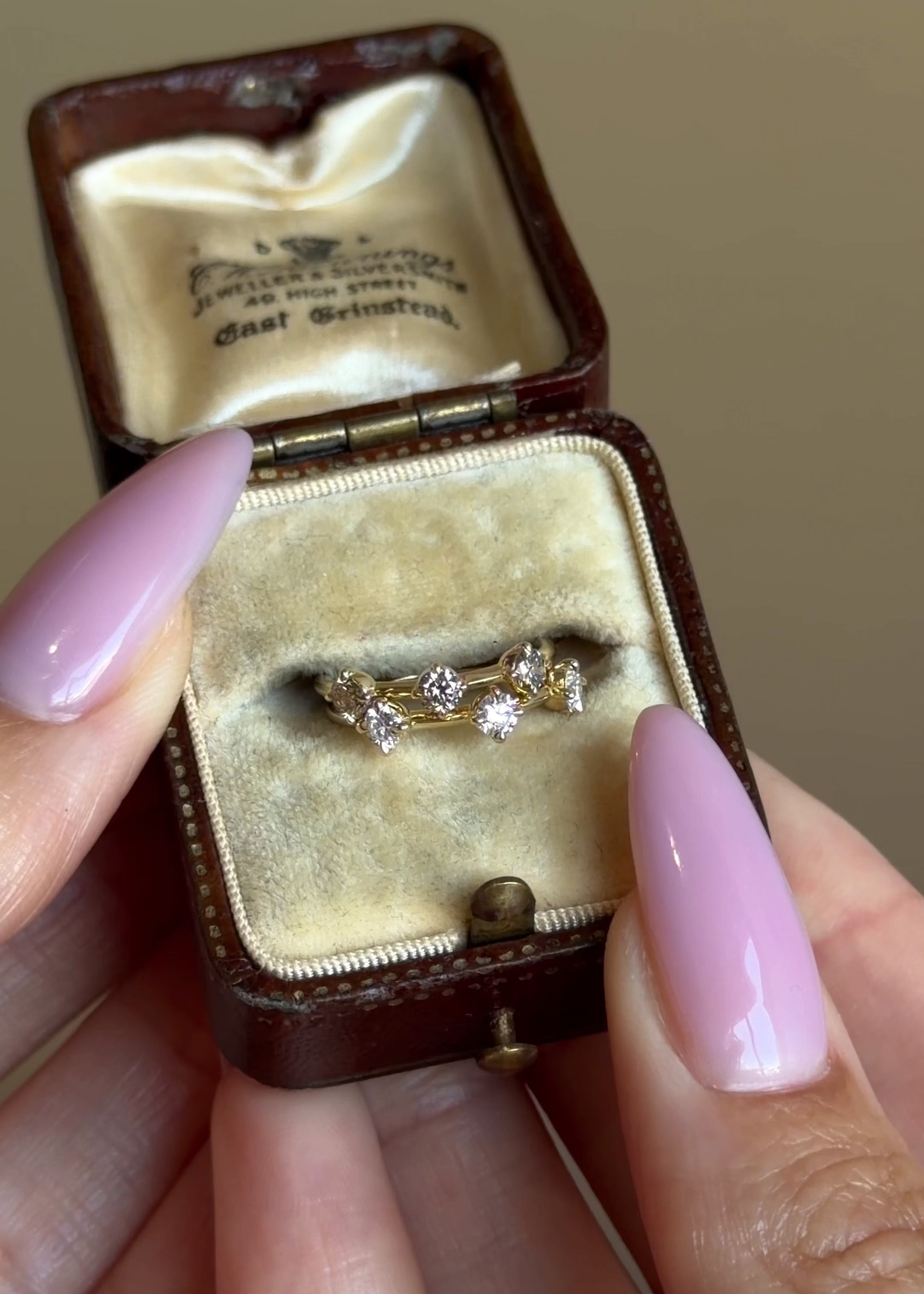Two Whisper Thin Round Brilliant Champagne and White Diamond 3 Stone Pinky Rings in 14K Yellow Gold.